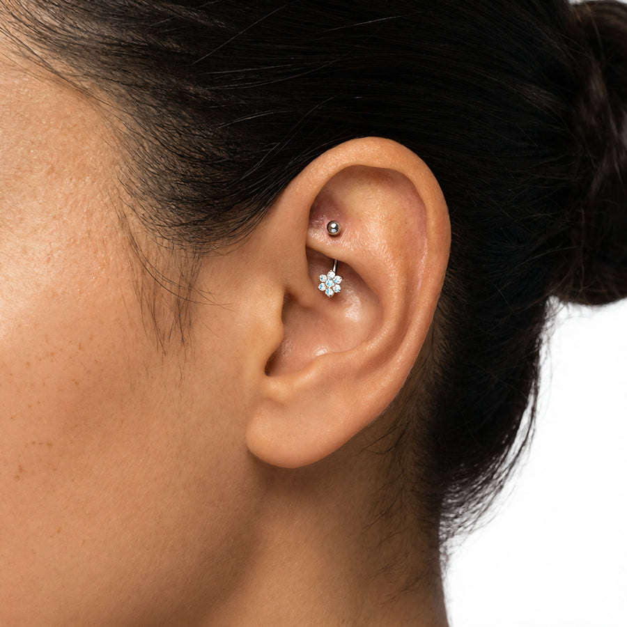 Piercing con fiore celeste in Titanio - Piercing per ombelico